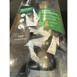 Kwikset Tylo Hall and Closet Passage Door Knob Round, Antique Brass 200t 5 cp v1